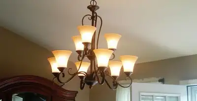Classic ceiling chandelier installation with warm lighting in Saint Petersburg, FL