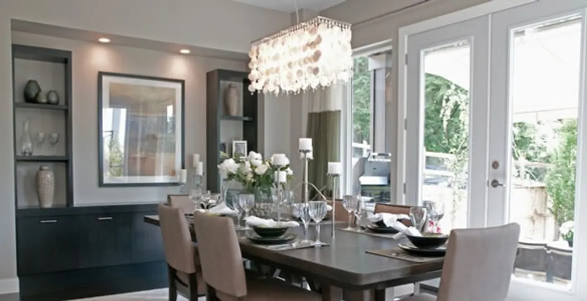 Elegant dining room chandelier installation above table in Saint Petersburg, FL