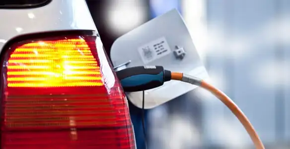 Electric car plugged into EV charger after professional installation in Saint Petersburg, FL