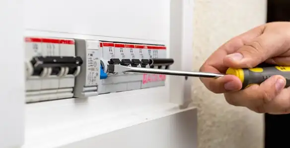 electrical panel upgrade service showing technician adjusting circuit breakers during system upgrade in Saint Petersburg, FL