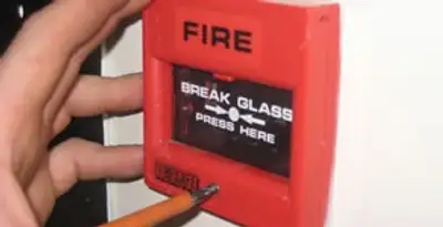 fire alarm installation service showing manual fire alarm pull station installed by licensed electricians in Saint Petersburg, FL
