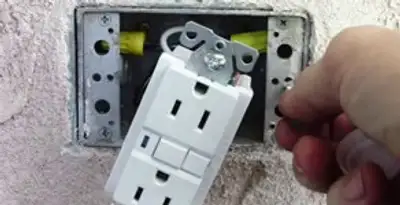 gfci circuits service showing installation of a ground fault circuit interrupter outlet by licensed electricians in Saint Petersburg, FL