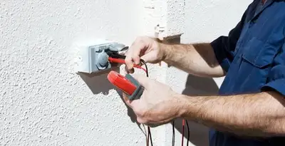 Electrician performing home electrical outlet and wiring inspection in Saint Petersburg, FL