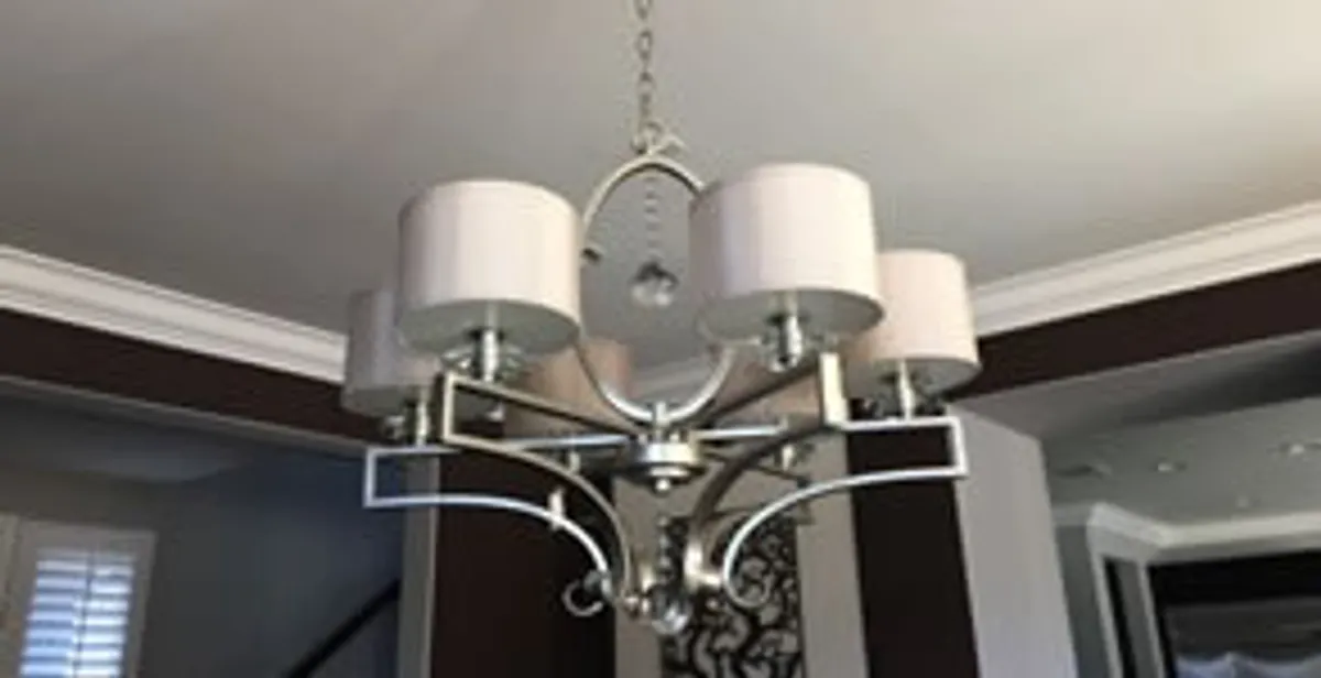 Modern chandelier installation with multiple light fixtures in Saint Petersburg, FL