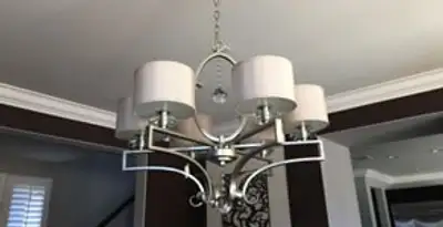 Modern chandelier installation with multiple light fixtures in Saint Petersburg, FL