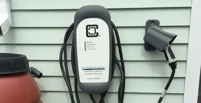 Outdoor electric vehicle charger installation on residential wall in Saint Petersburg, FL