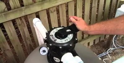 pool pumps service showing professional adjustment of pool pump control system in Saint Petersburg, FL