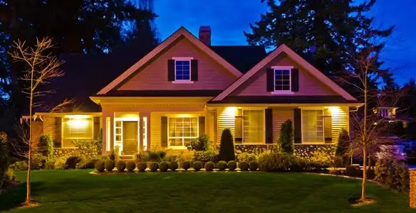 security light installation services illuminating a residential exterior at night in Saint Petersburg, FL