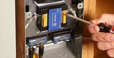 Whole home surge protection device being installed by a licensed electrician to protect electrical systems in Saint Petersburg, FL
